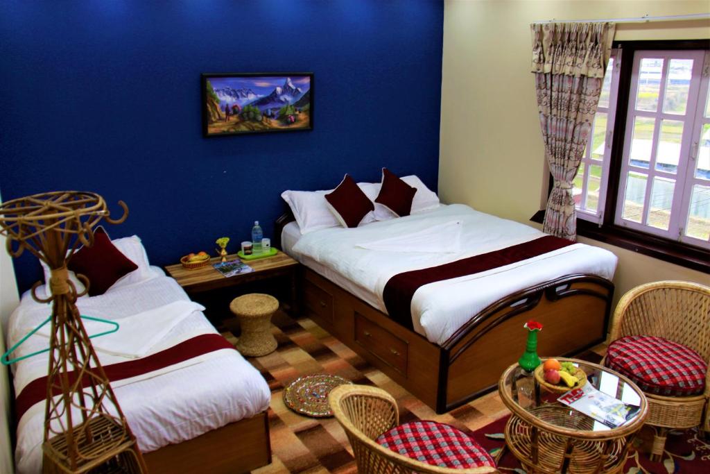 Postel nebo postele na pokoji v ubytování Homestay Nepal