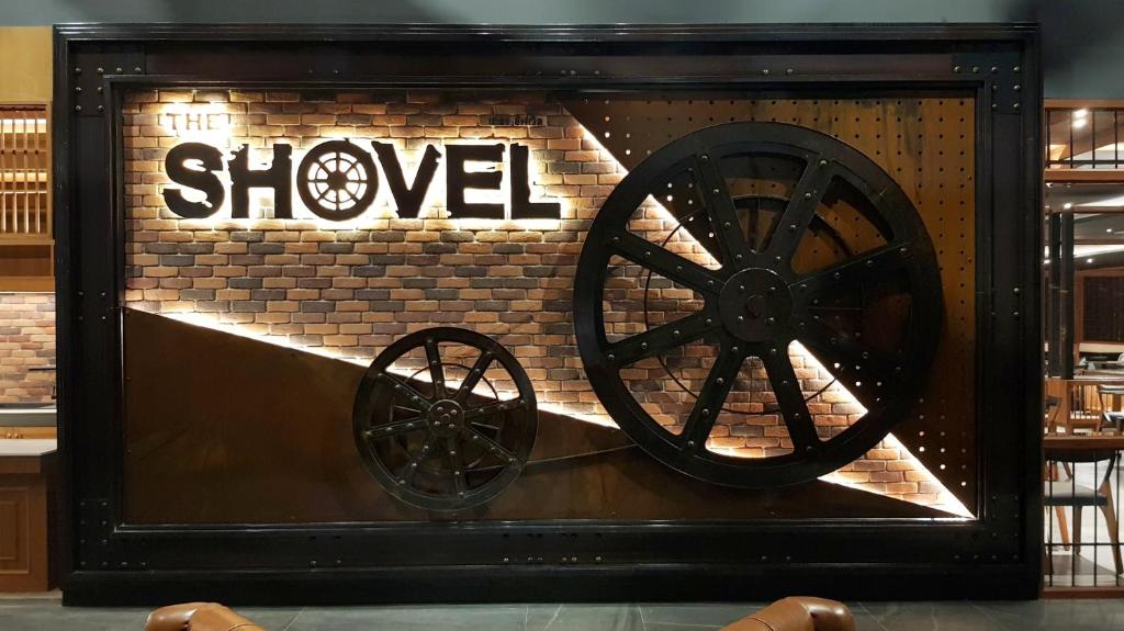 a wooden wagon wheel on display in a store at Aurico Kata Resort & Spa - SHA Extra Plus in Kata Beach