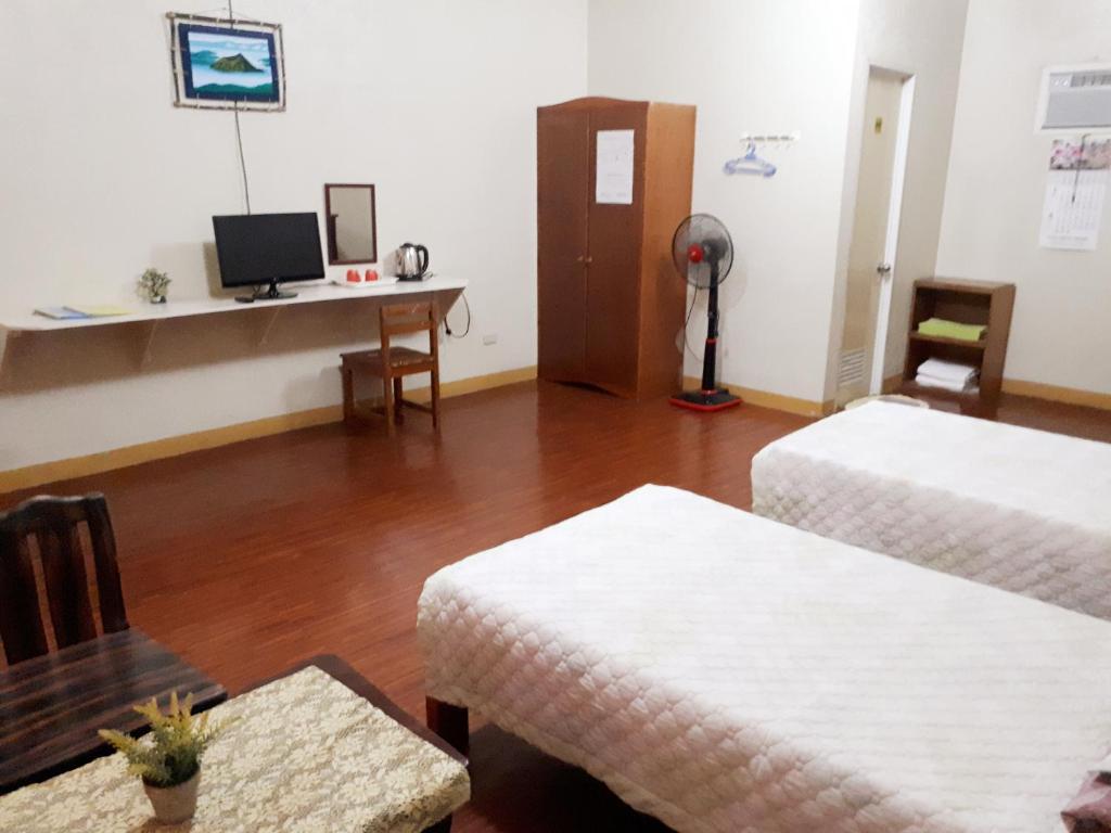 TV a/nebo společenská místnost v ubytování Minine Guesthouse