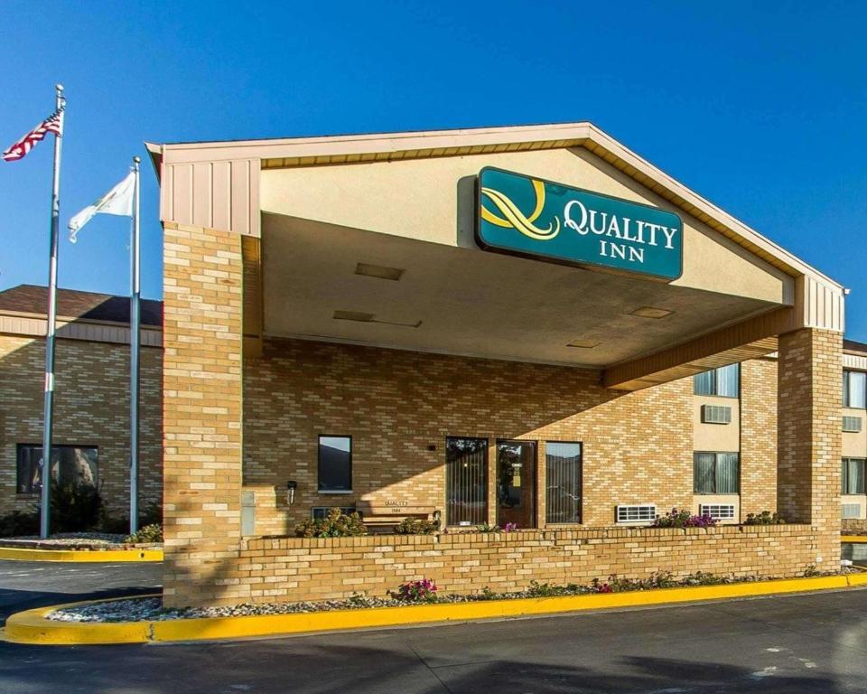 a quality inn building with a sign on it at Quality Inn Burlington near Hwy 34 in Burlington