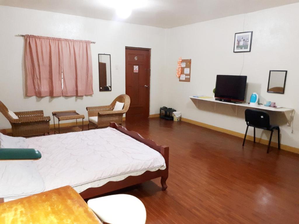 TV a/nebo společenská místnost v ubytování Minine Guesthouse