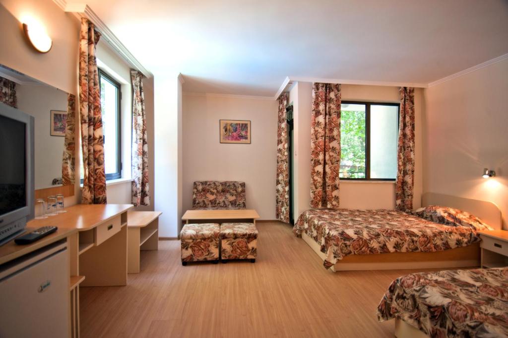 Postel nebo postele na pokoji v ubytování Hotel Sigma
