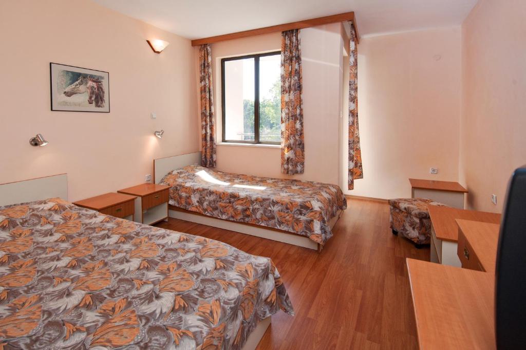 Postel nebo postele na pokoji v ubytování Hotel Sigma
