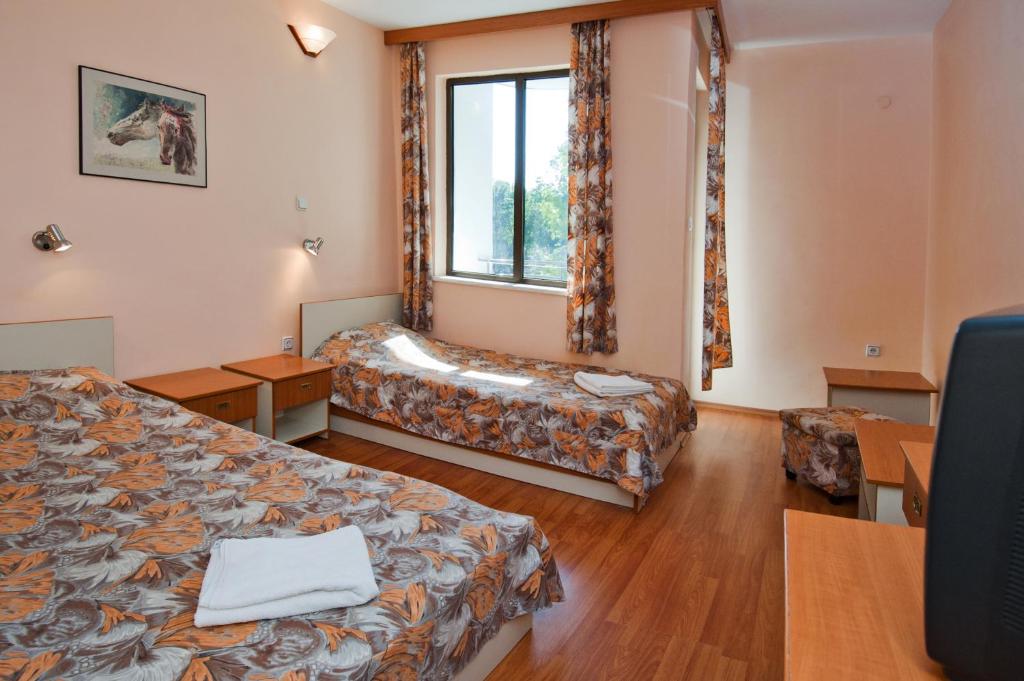 Postel nebo postele na pokoji v ubytování Hotel Sigma