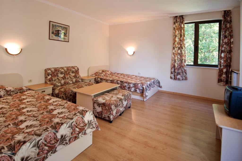 Postel nebo postele na pokoji v ubytování Hotel Sigma