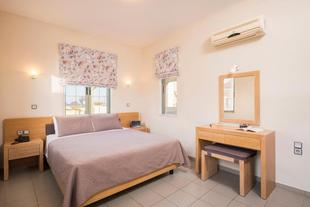 A bed or beds in a room at Mistrali Suites & Apartments