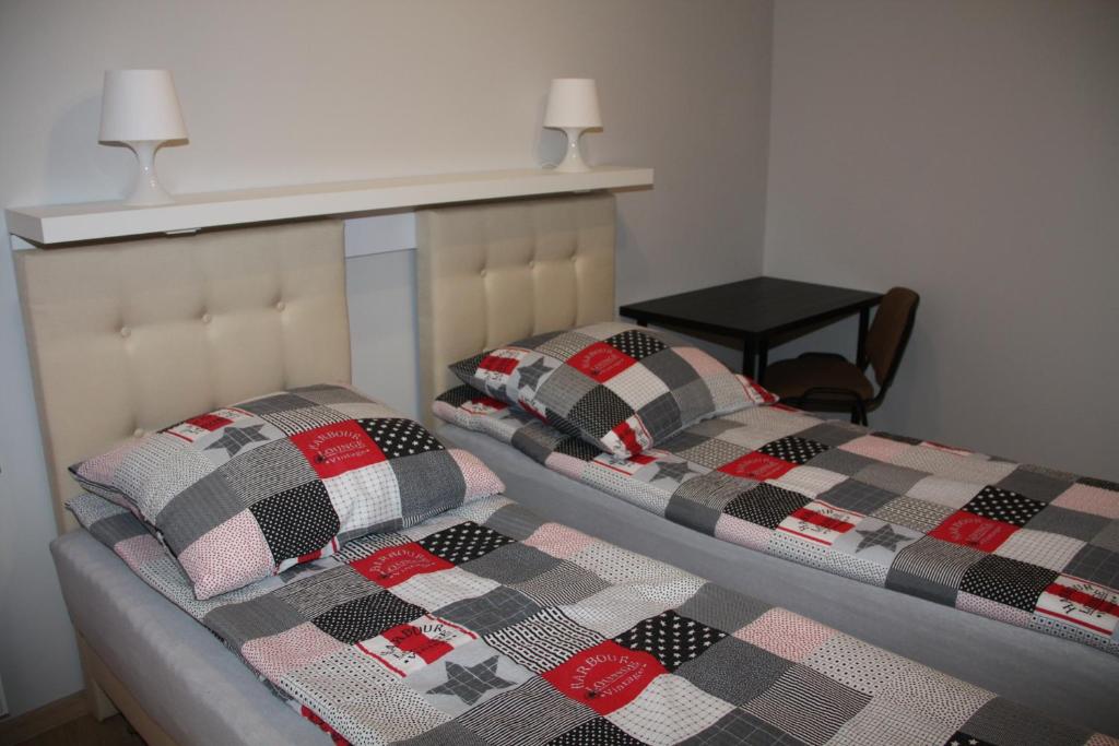 Posteľ alebo postele v izbe v ubytovaní Apartament Matejki