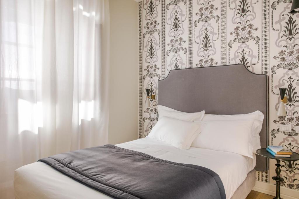 Postel nebo postele na pokoji v ubytování Favilla Hotel di Charme