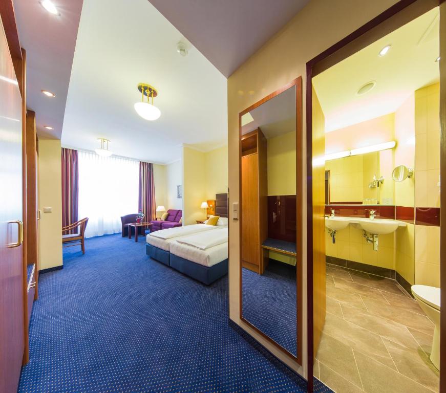 Postel nebo postele na pokoji v ubytování Austria Classic Hotel Wien