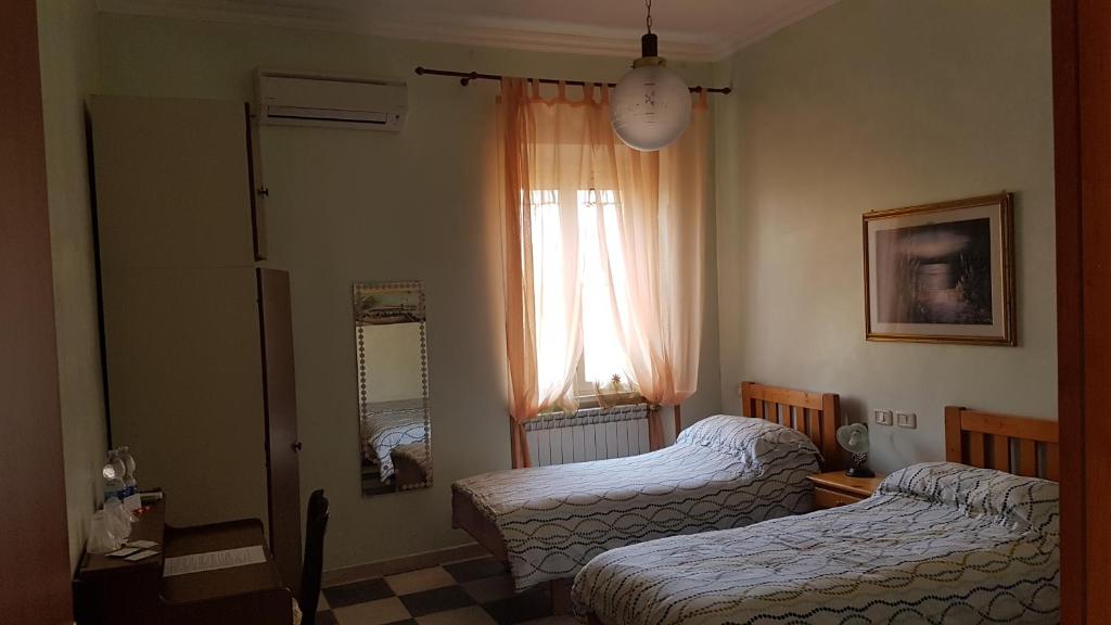 Łóżko lub łóżka w pokoju w obiekcie Guest house Il Nido