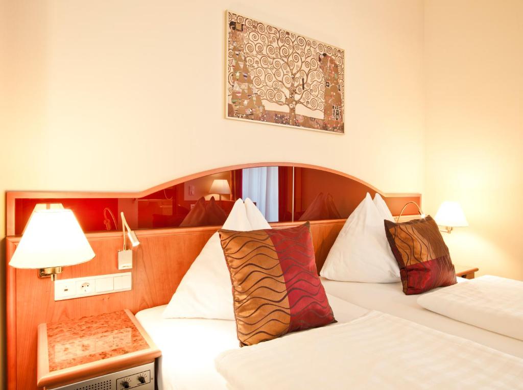 Postel nebo postele na pokoji v ubytování Austria Classic Hotel Wien