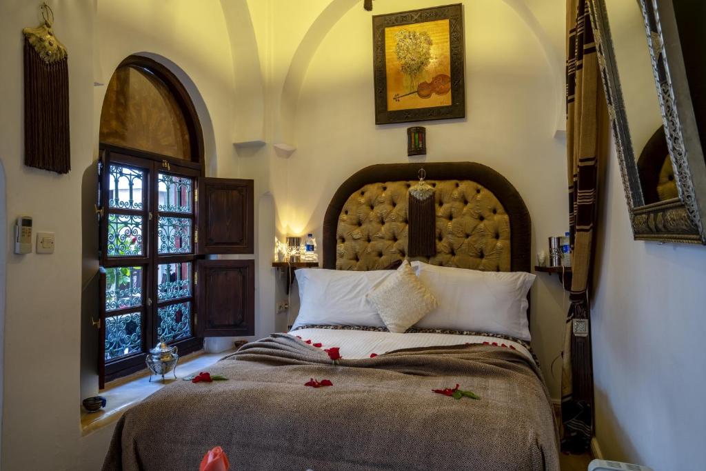 Una cama o camas en una habitación de Riad Anabel