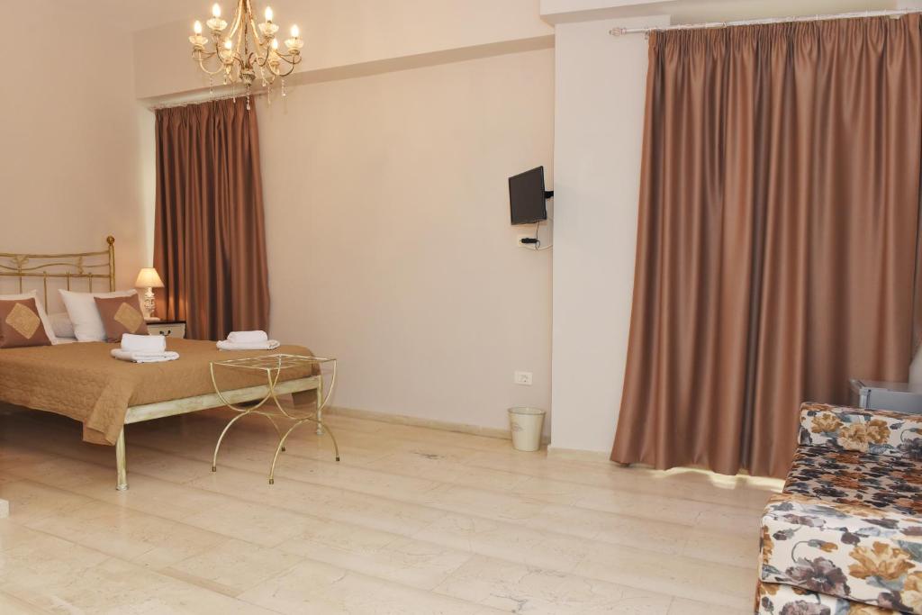 Postel nebo postele na pokoji v ubytování Oisyra Hotel