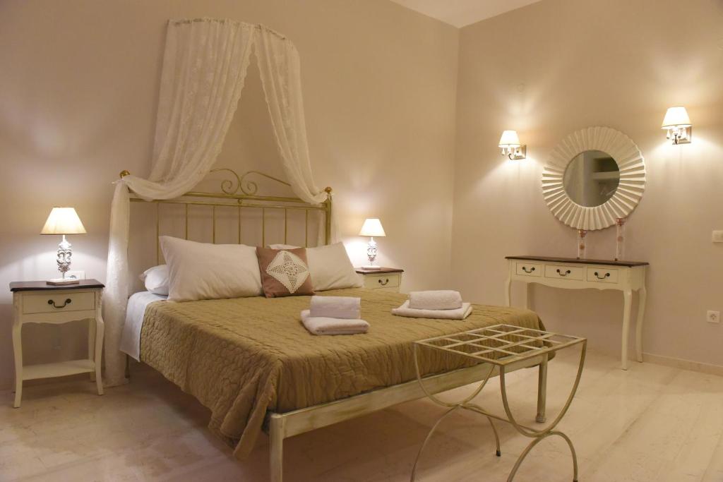 Postel nebo postele na pokoji v ubytování Oisyra Hotel