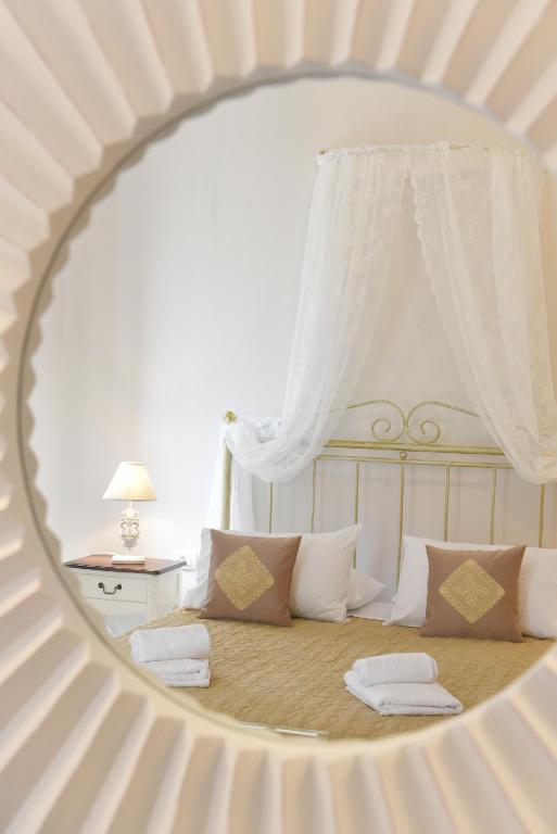 Postel nebo postele na pokoji v ubytování Oisyra Hotel