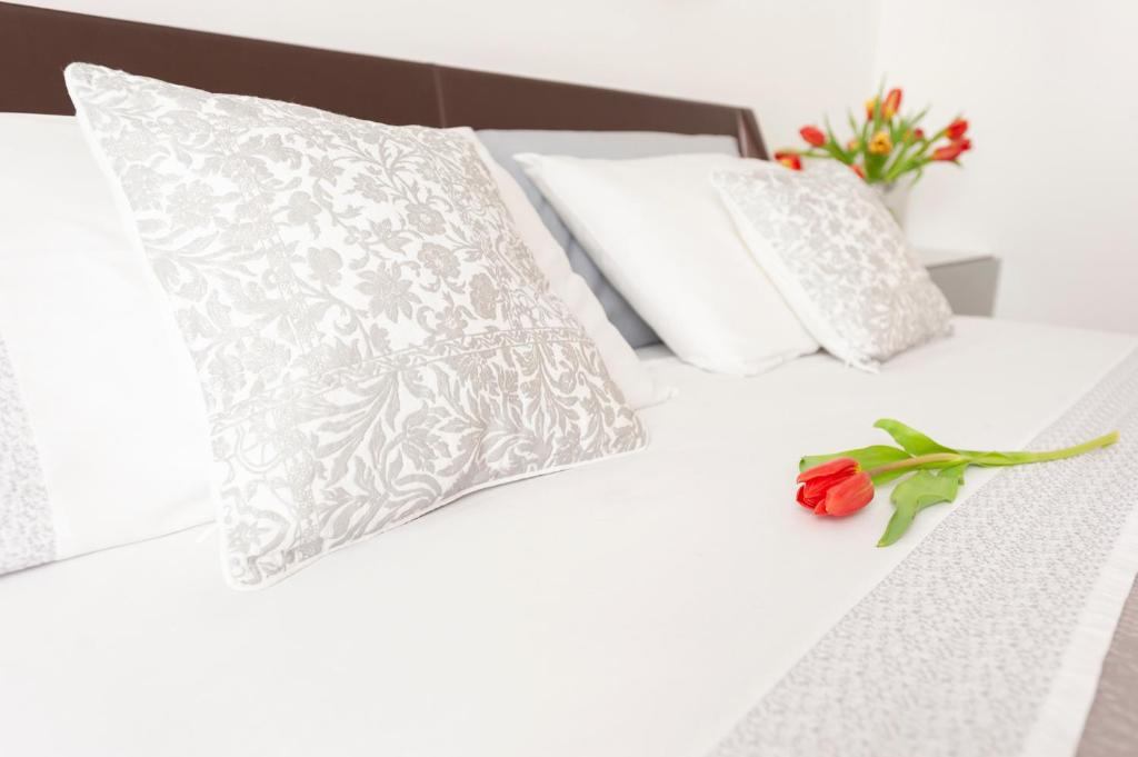 Łóżko lub łóżka w pokoju w obiekcie Via Bozzi Luxury Home