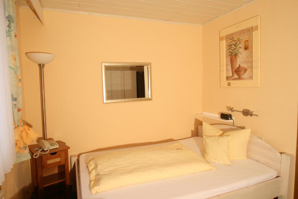 Postel nebo postele na pokoji v ubytování Hotel Irene
