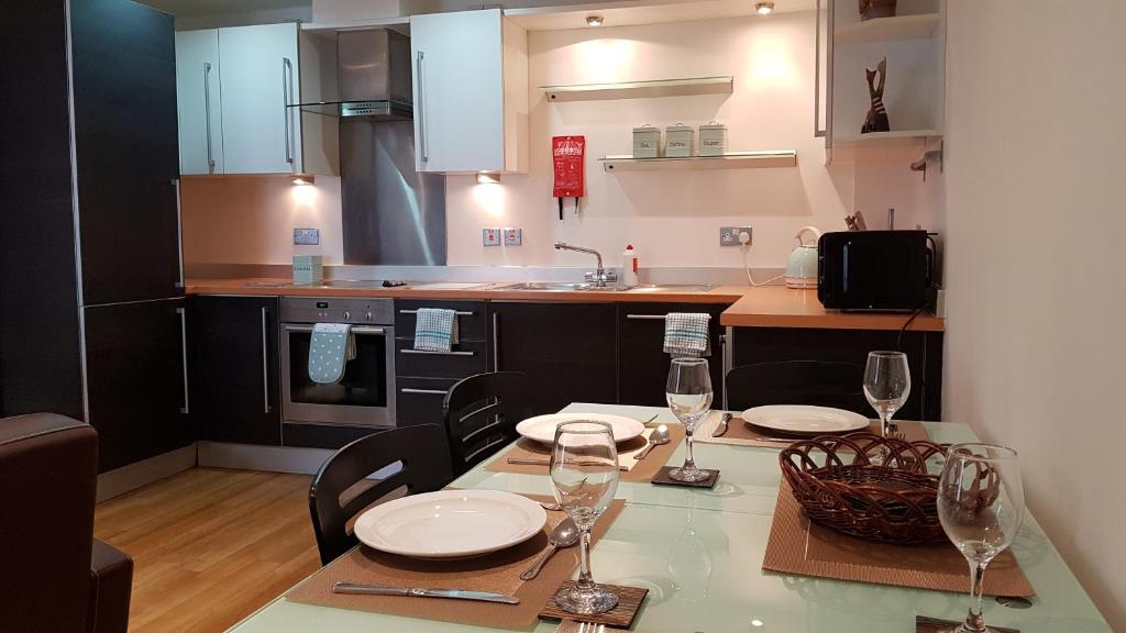 
A kitchen or kitchenette at Abbots Yard Apartments with Lily Pad Living
