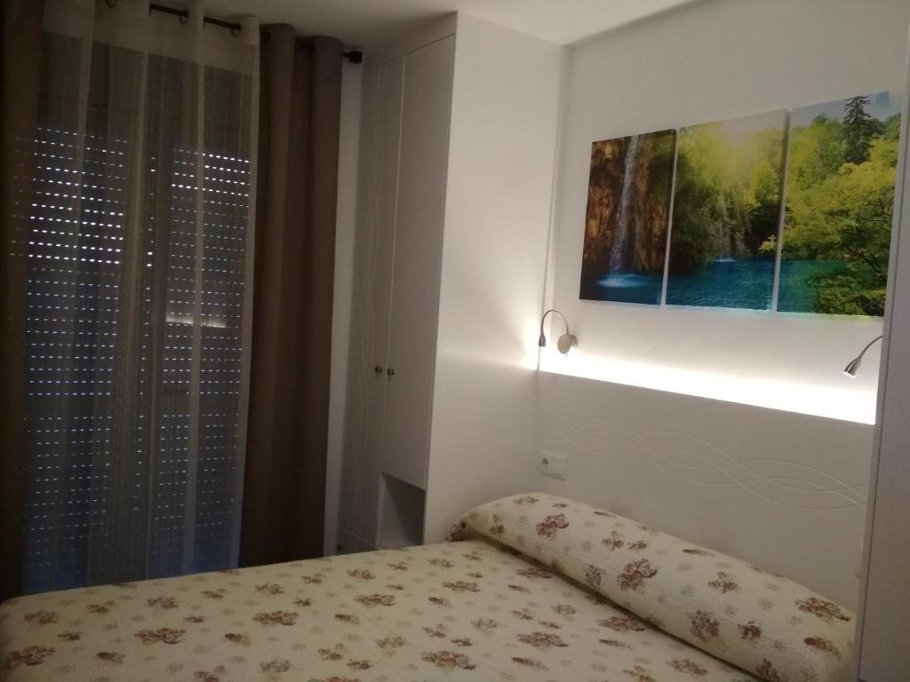 Posteľ alebo postele v izbe v ubytovaní APARTAMENTOS LA VEREDA