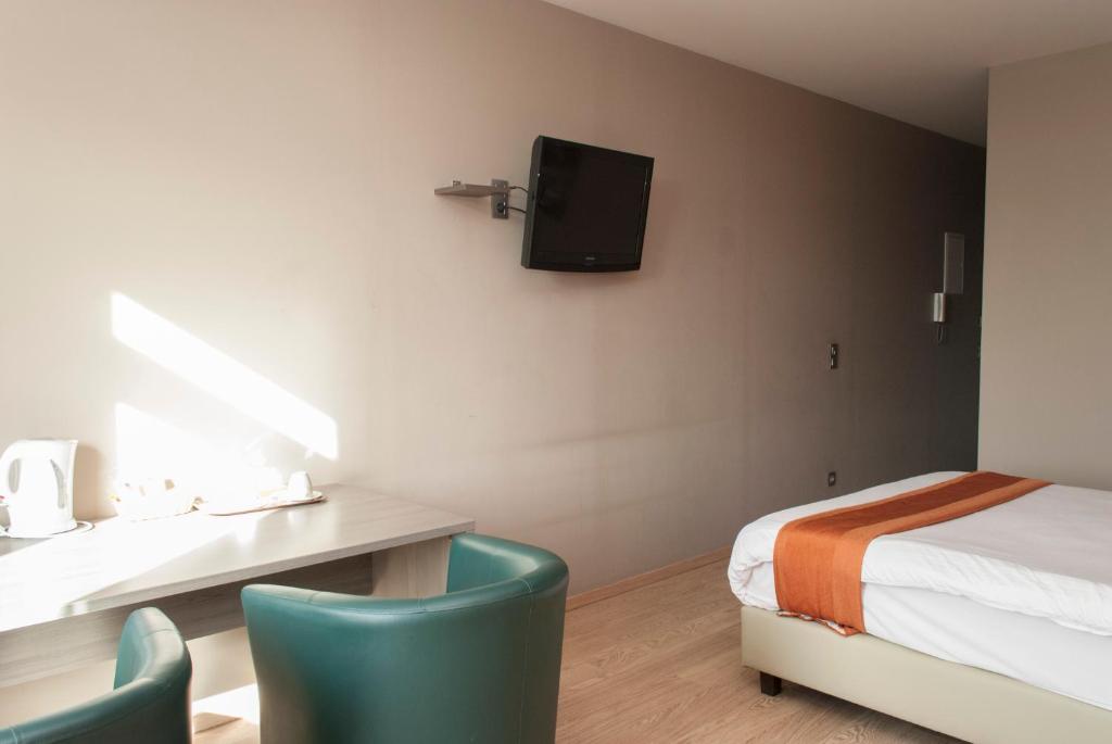 Postel nebo postele na pokoji v ubytování Hotel Castel