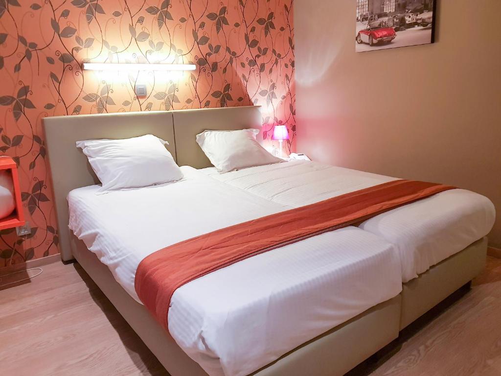 Postel nebo postele na pokoji v ubytování Hotel Castel