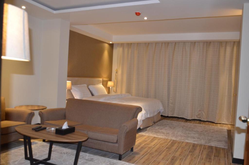 Postel nebo postele na pokoji v ubytování منازل الشمال للشقق المخدومة Manazel Al Shamal Serviced Apartments
