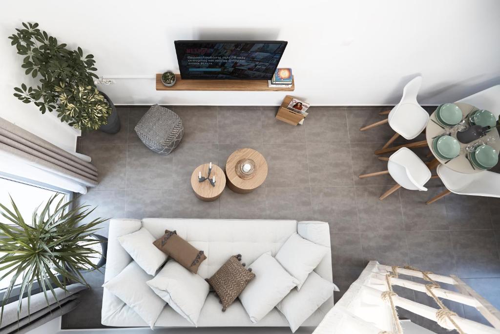 TV a/nebo společenská místnost v ubytování Pnoi Luxury Suites
