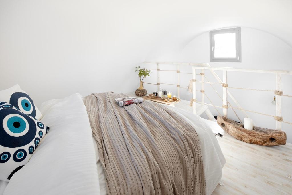 Postel nebo postele na pokoji v ubytování Pnoi Luxury Suites