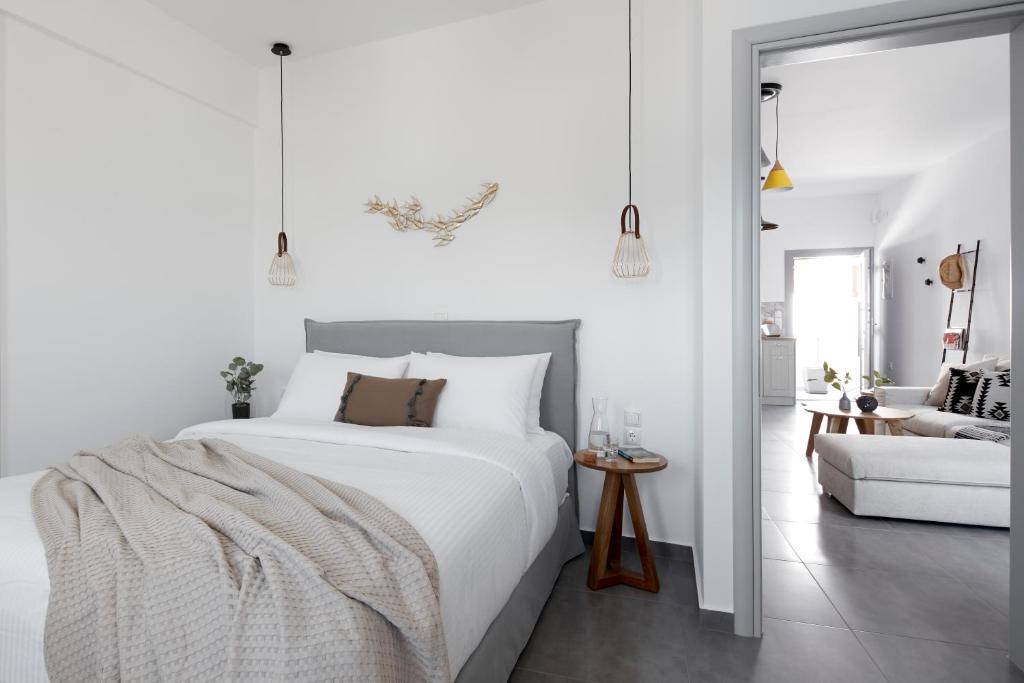 Postel nebo postele na pokoji v ubytování Pnoi Luxury Suites