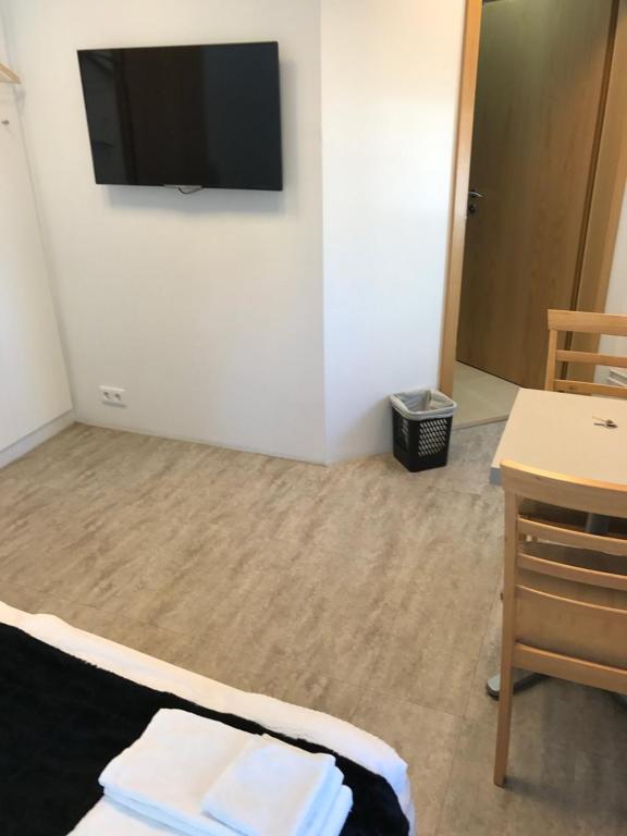 TV a/nebo společenská místnost v ubytování REK Inn