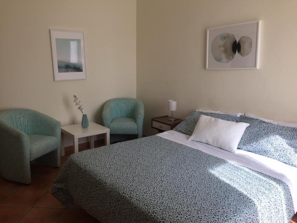 Ein Bett oder Betten in einem Zimmer der Unterkunft Palazzo Giordano