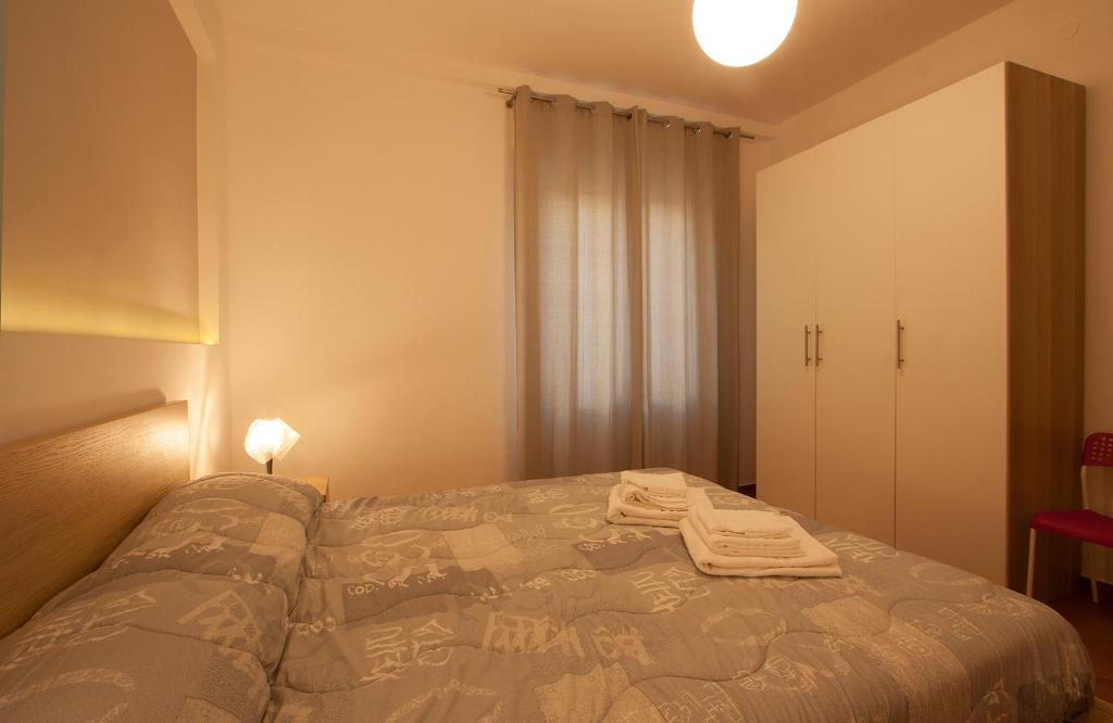 Posteľ alebo postele v izbe v ubytovaní LAMEZIA CENTRO, APPARTAMENTO GIORGIA