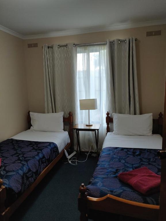Postel nebo postele na pokoji v ubytování Summers Rest Units