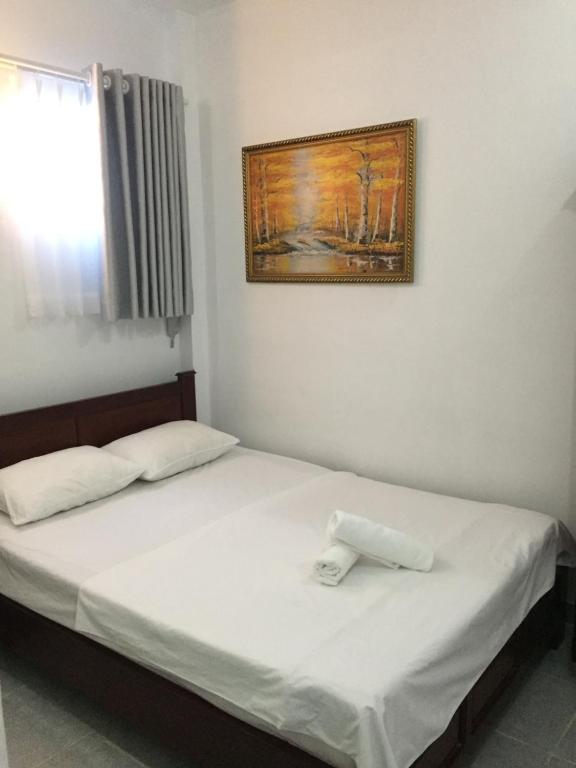 Voodi või voodid majutusasutuse Vy Khanh Guesthouse toas