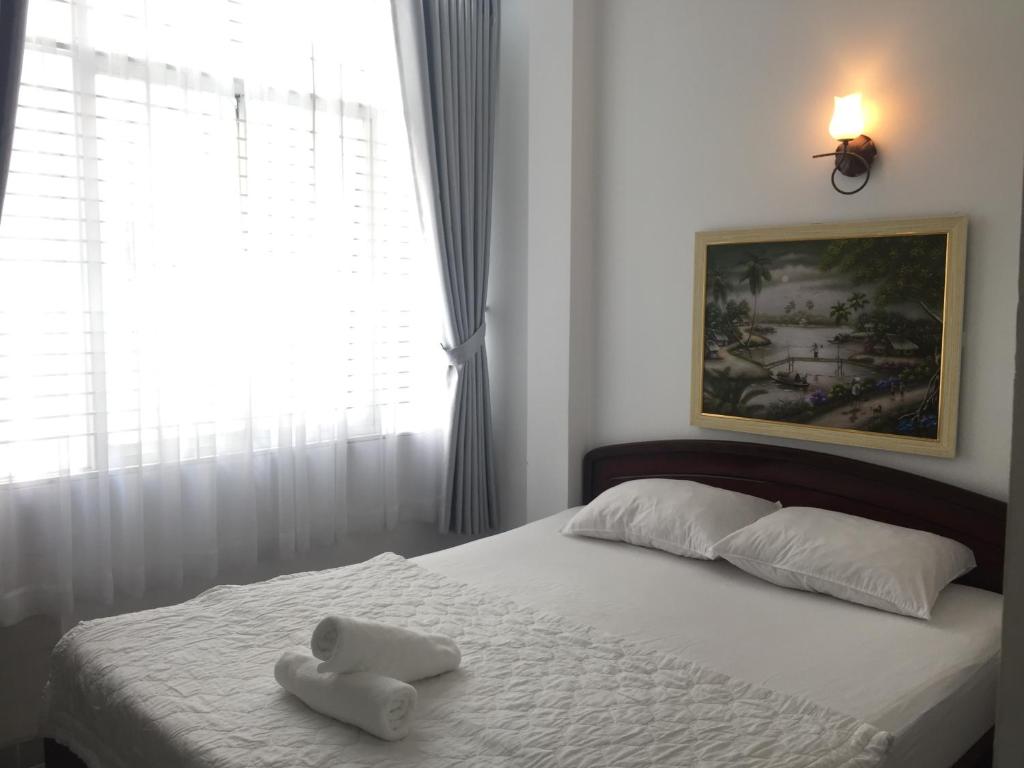 Voodi või voodid majutusasutuse Vy Khanh Guesthouse toas