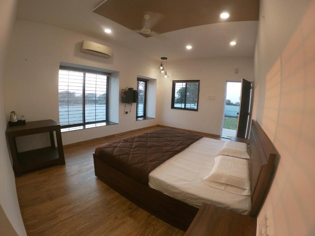Postel nebo postele na pokoji v ubytování Tripvana Patio Home