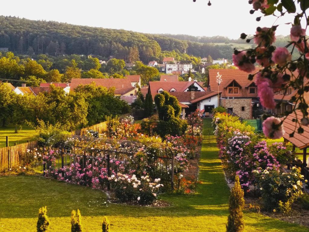 a garden in a village with flowers at penzion ROSETA in Radějov