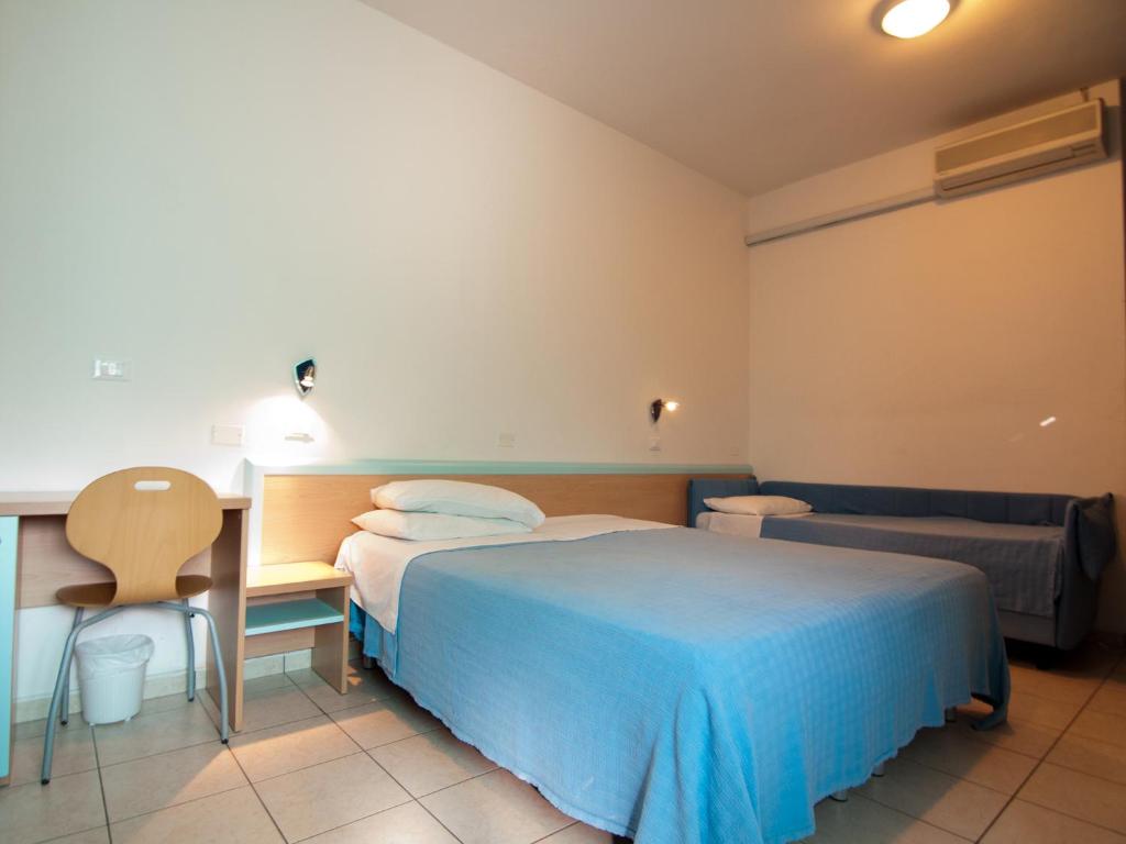 Postel nebo postele na pokoji v ubytování Hotel Savina