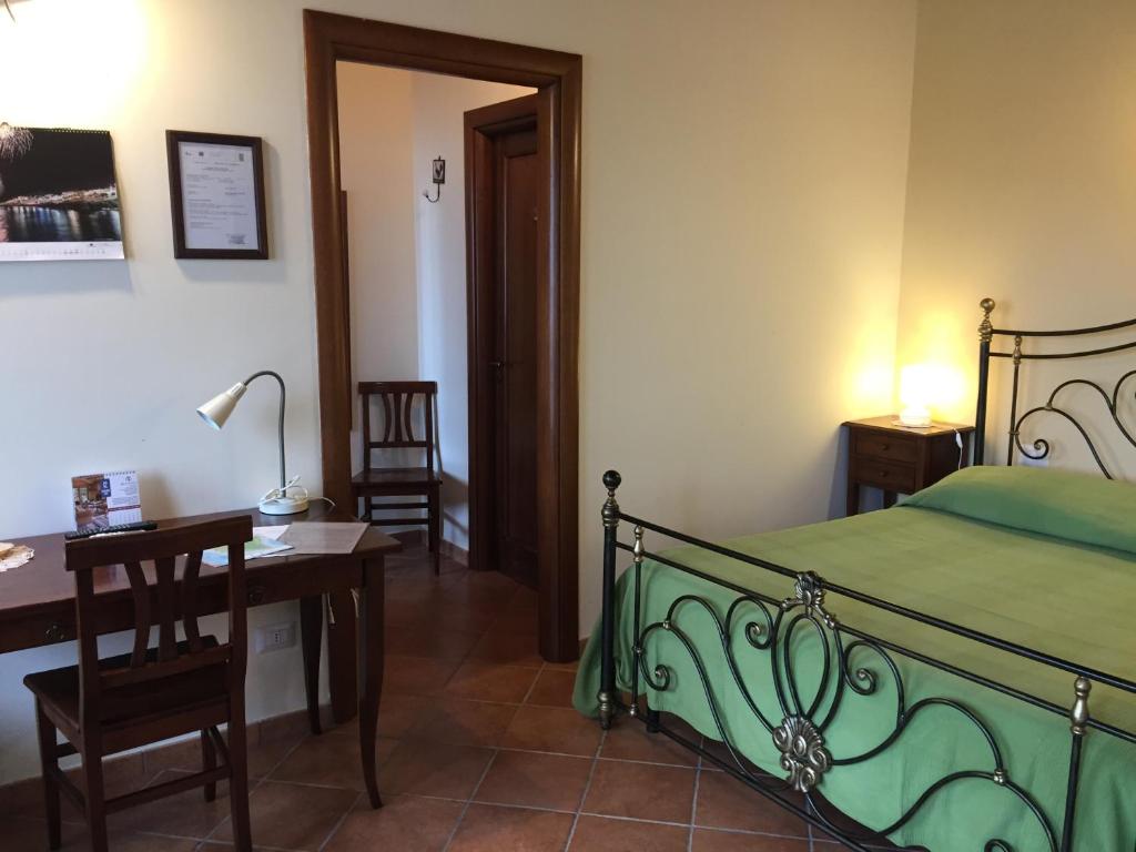 Postel nebo postele na pokoji v ubytování Agriturismo Arangèa