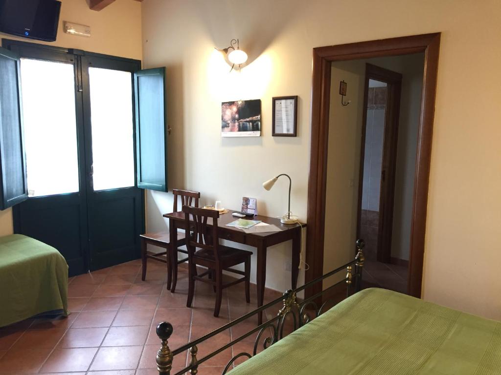 Postel nebo postele na pokoji v ubytování Agriturismo Arangèa