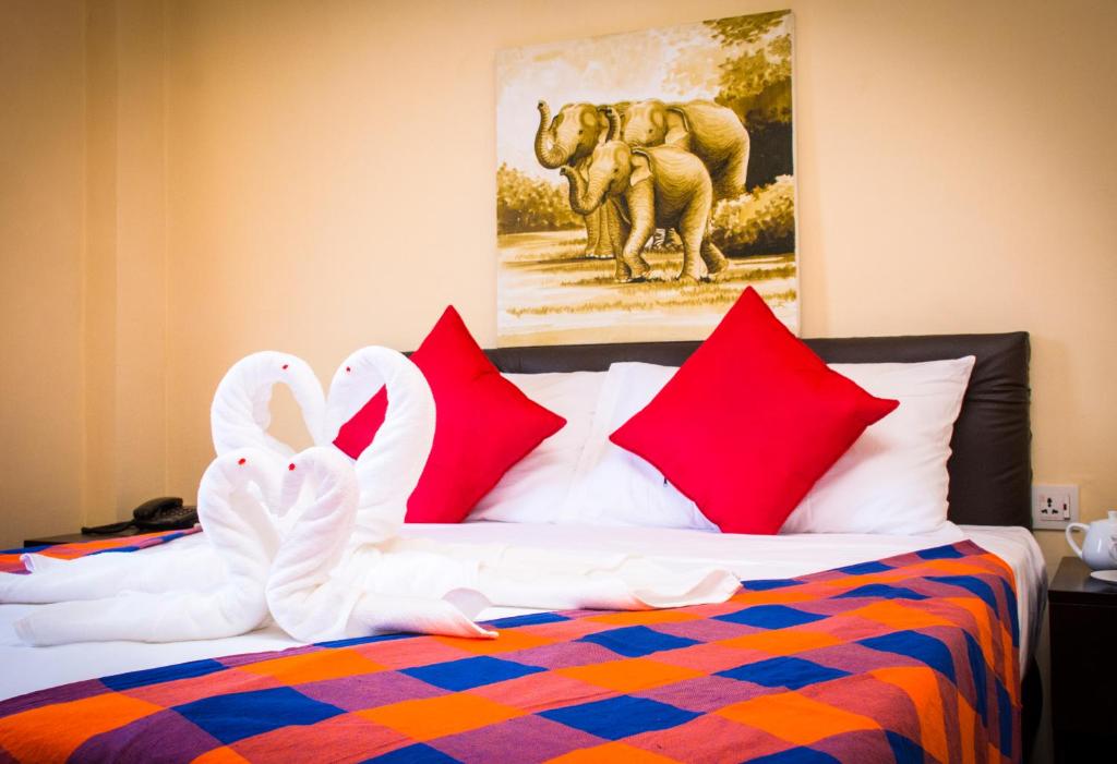 Postel nebo postele na pokoji v ubytování Hotel Lakefield