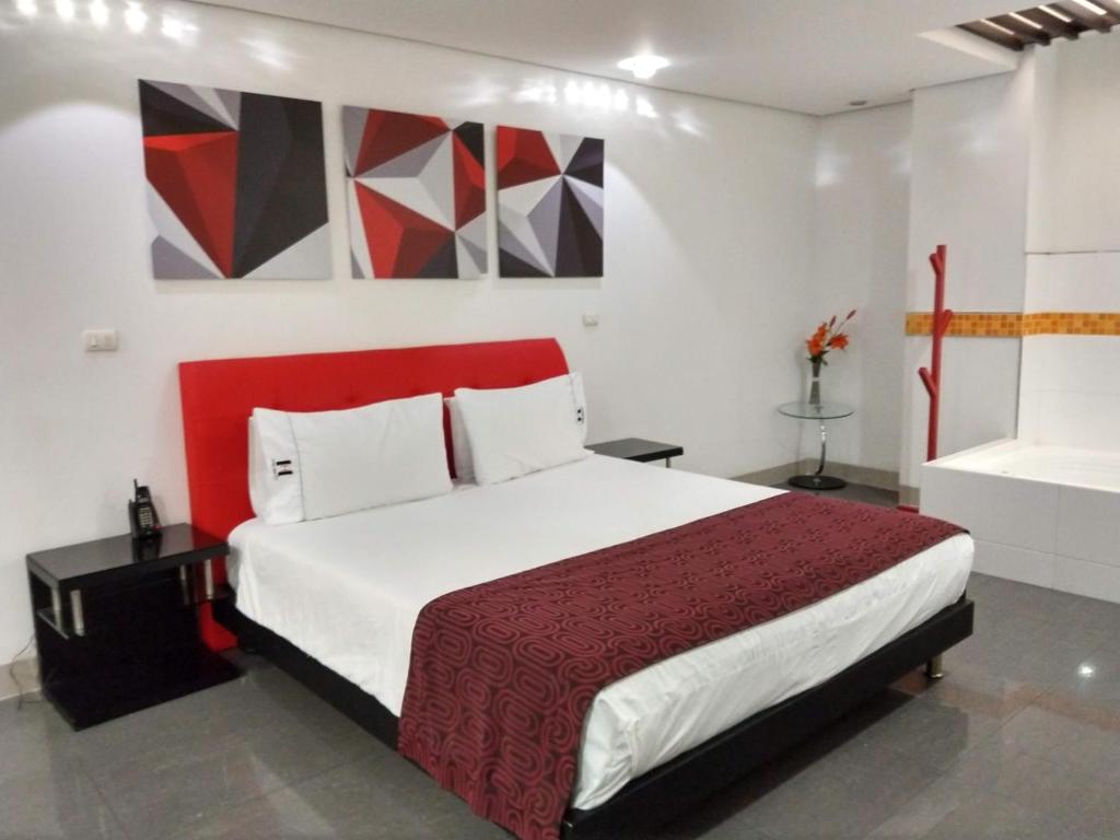 Postel nebo postele na pokoji v ubytování Hotel Merlott 70