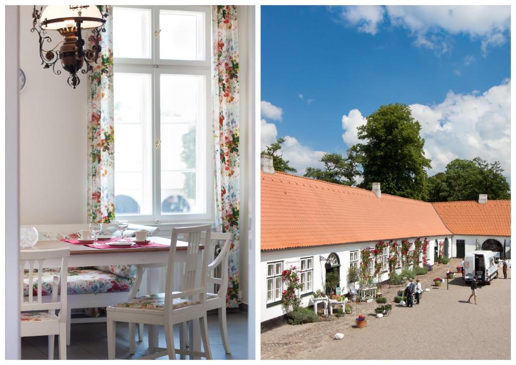 een kamer met een tafel en een raam met een huis bij Schloss Glücksburg in Glücksburg