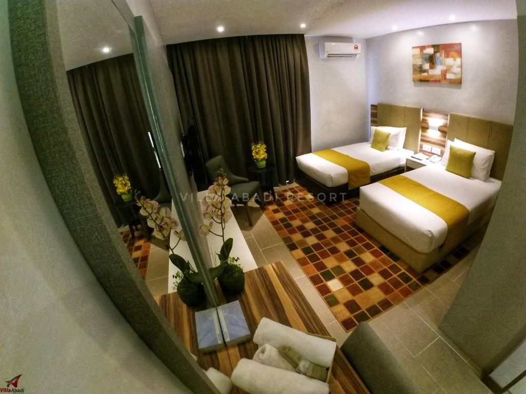Postel nebo postele na pokoji v ubytování Villa Abadi Resort