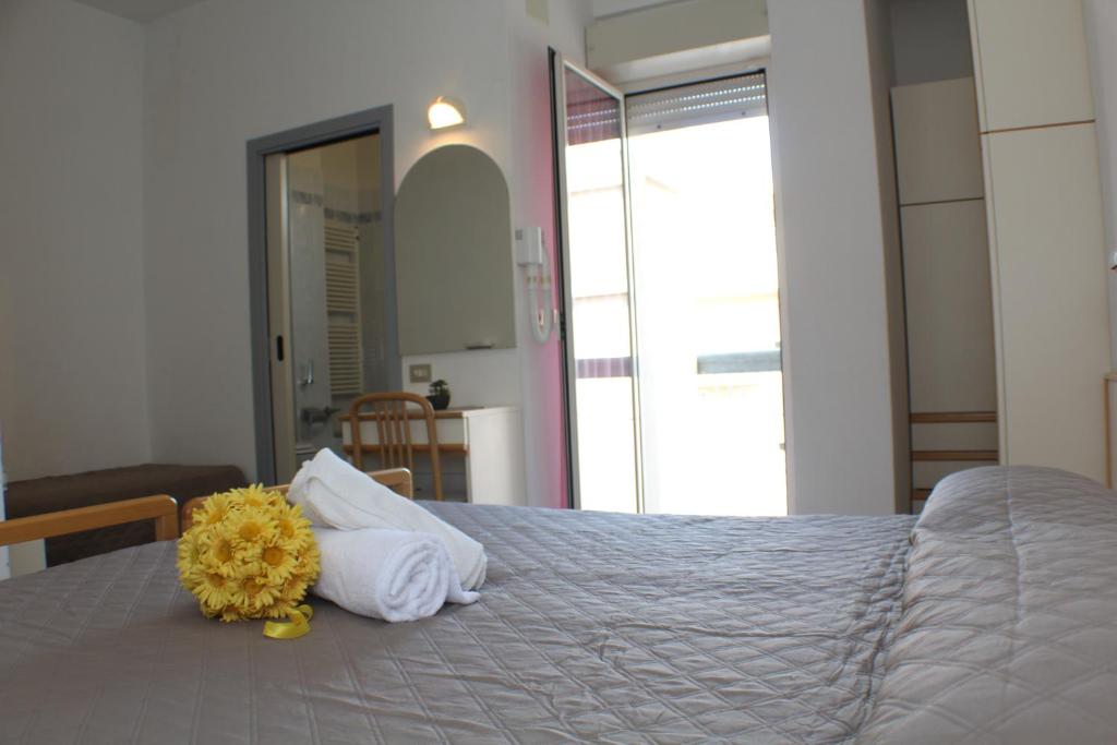 Postel nebo postele na pokoji v ubytování Hotel Caesar