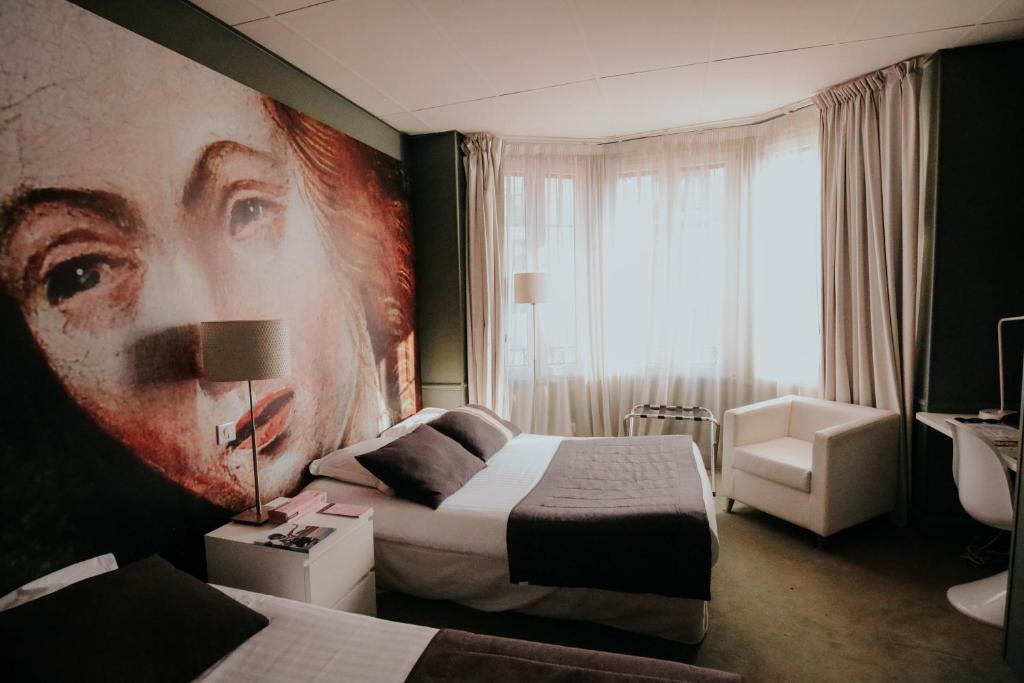 Postel nebo postele na pokoji v ubytování Hôtel Cecyl Reims Centre