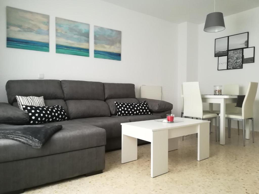 a living room with a couch and a table at Gonga House in Tarifa