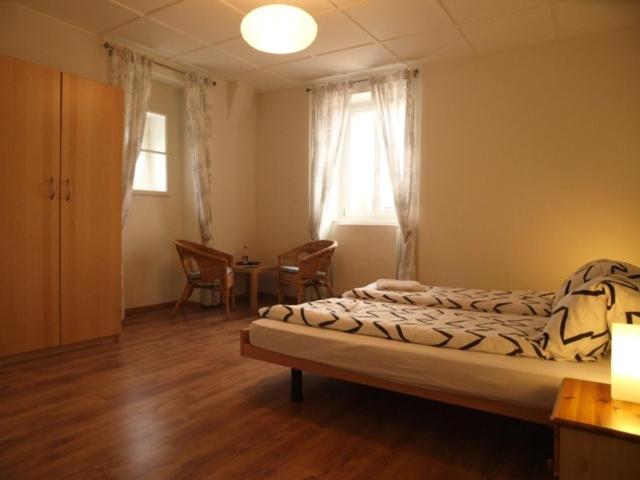 Postel nebo postele na pokoji v ubytování Hôtel Garni Villa Carmen