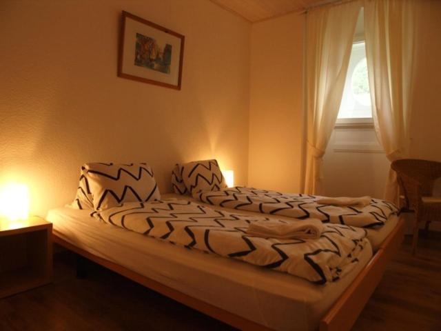 Postel nebo postele na pokoji v ubytování Hôtel Garni Villa Carmen
