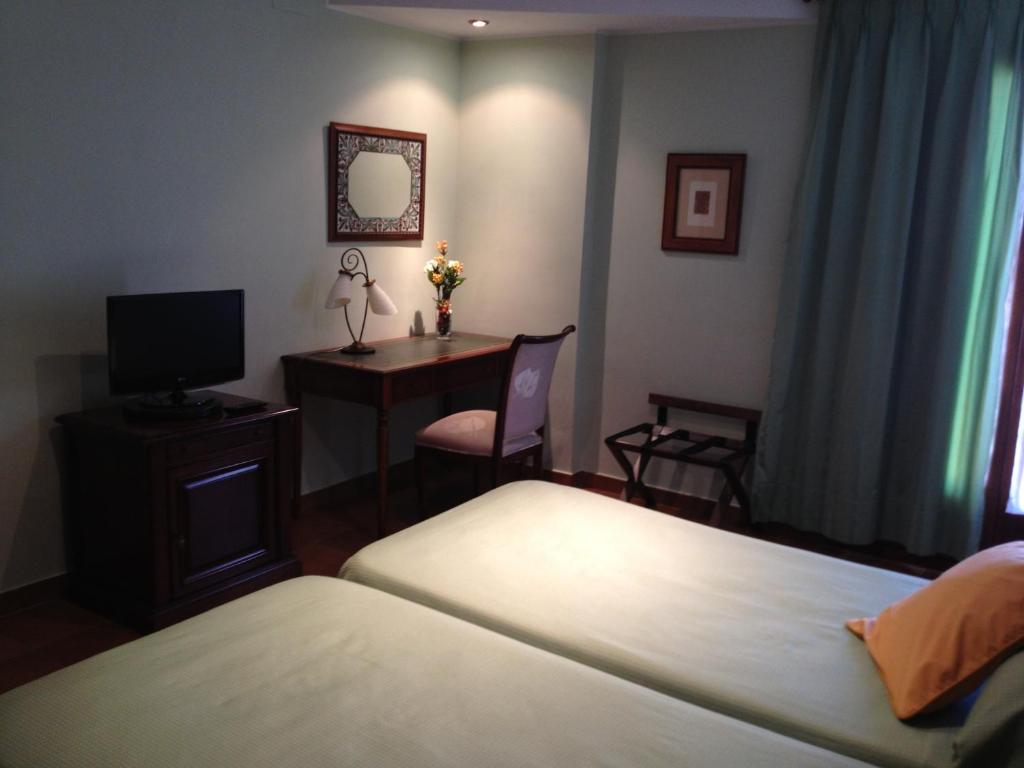 Postel nebo postele na pokoji v ubytování Hotel Esther